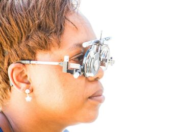 woman wearing glasses measuring device