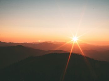 silhoutte of mountains during sunset