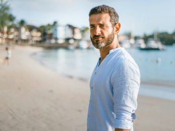 man standing on beach during daytime