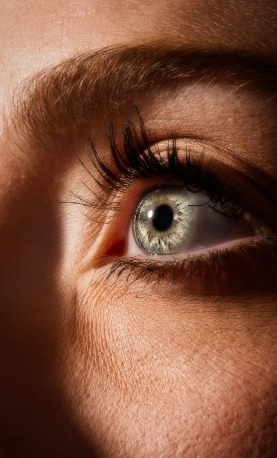 persons blue eyes in close up photography