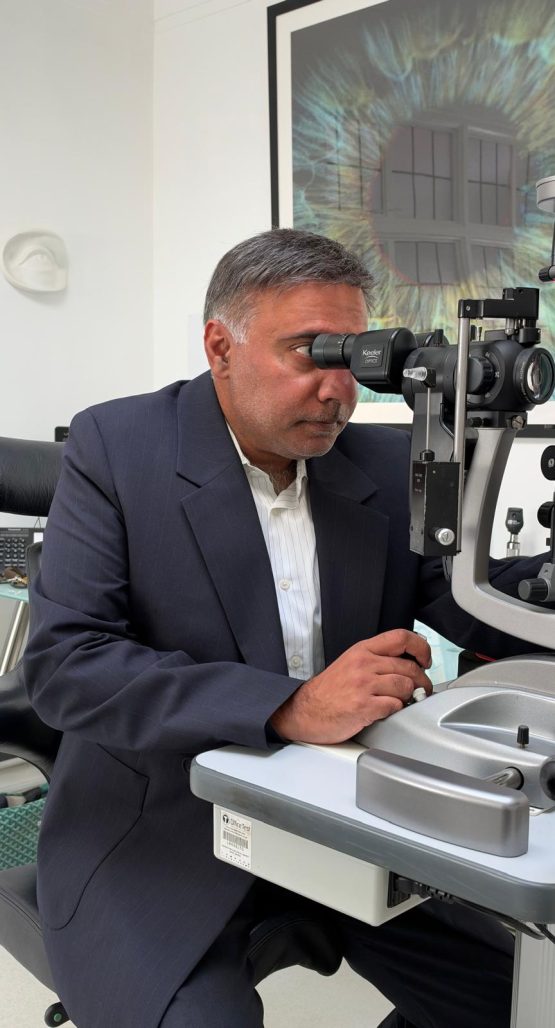 Mr Vik Sharma, Lead Glaucoma Surgeon at Royal Free London NHS Trust, examining a patient at the London Ophthalmology Centre