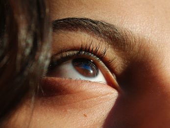 persons blue eyes and black hair