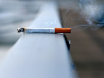 white cigarette stick on white wall