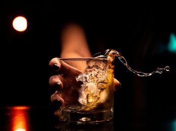 clear drinking glass with ice cubes